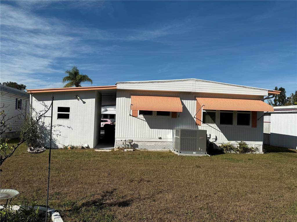 9900 Ulmerton Road, Unit 242 Largo, FL 33771 - Photo 18 of 21 a front view of a house with a garage