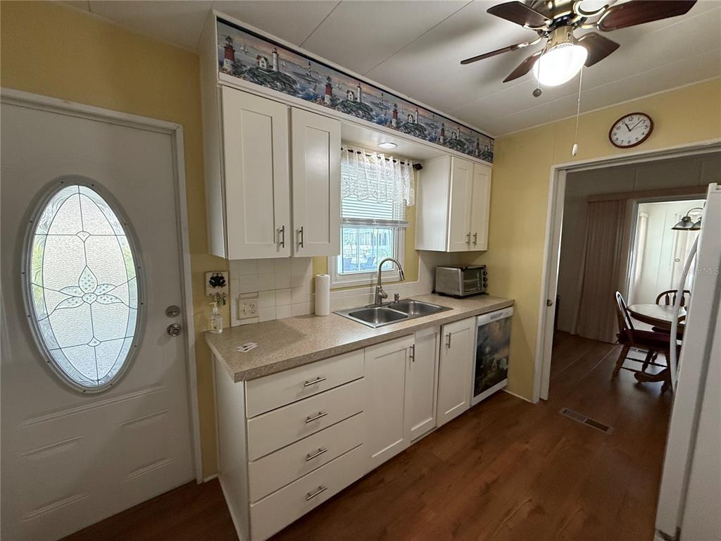 9900 Ulmerton Road, Unit 242 Largo, FL 33771 - Photo 3 of 21 a view of a hallway with washer and dryer
