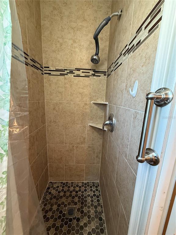 9900 Ulmerton Road, Unit 242 Largo, FL 33771 - Photo 10 of 21 a bathroom with a shower