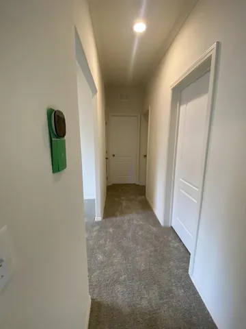 a view of a hallway to of a house