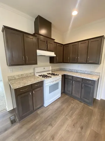 a kitchen with a stove and a microwave