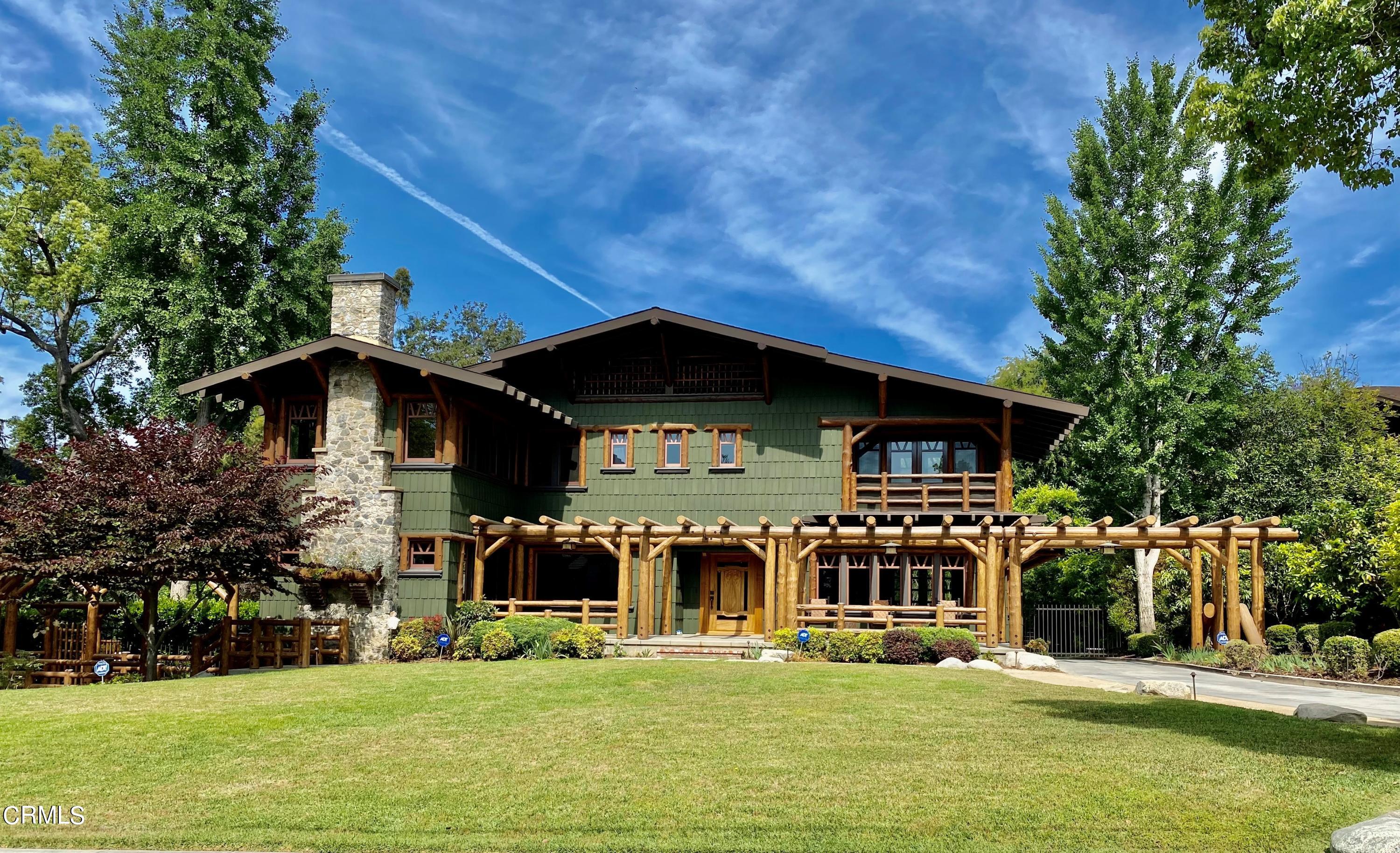 a front view of a house with a small yard