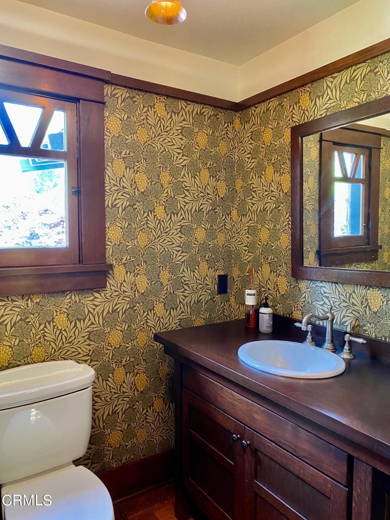 1361 Ridge Way Pasadena, CA 91106 - Photo 13 of 31 a bathroom with a toilet a sink and mirror