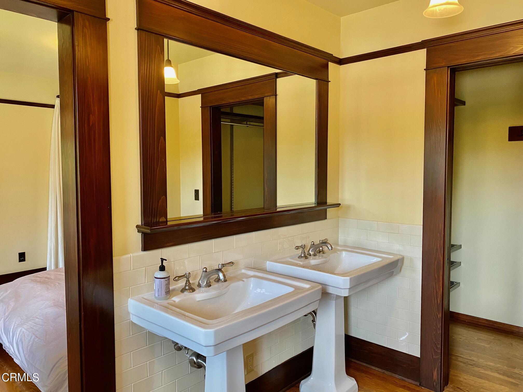 1361 Ridge Way Pasadena, CA 91106 - Photo 16 of 31 a bathroom with a sink and a mirror