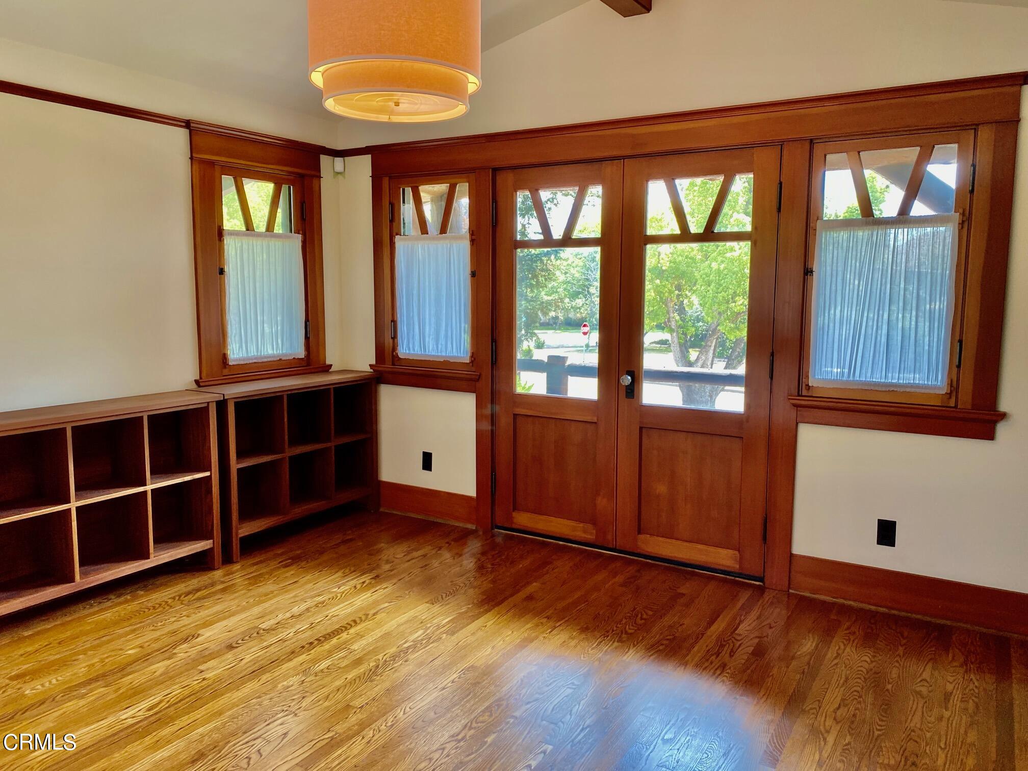1361 Ridge Way Pasadena, CA 91106 - Photo 17 of 31 a view of an empty room with wooden floor and windows