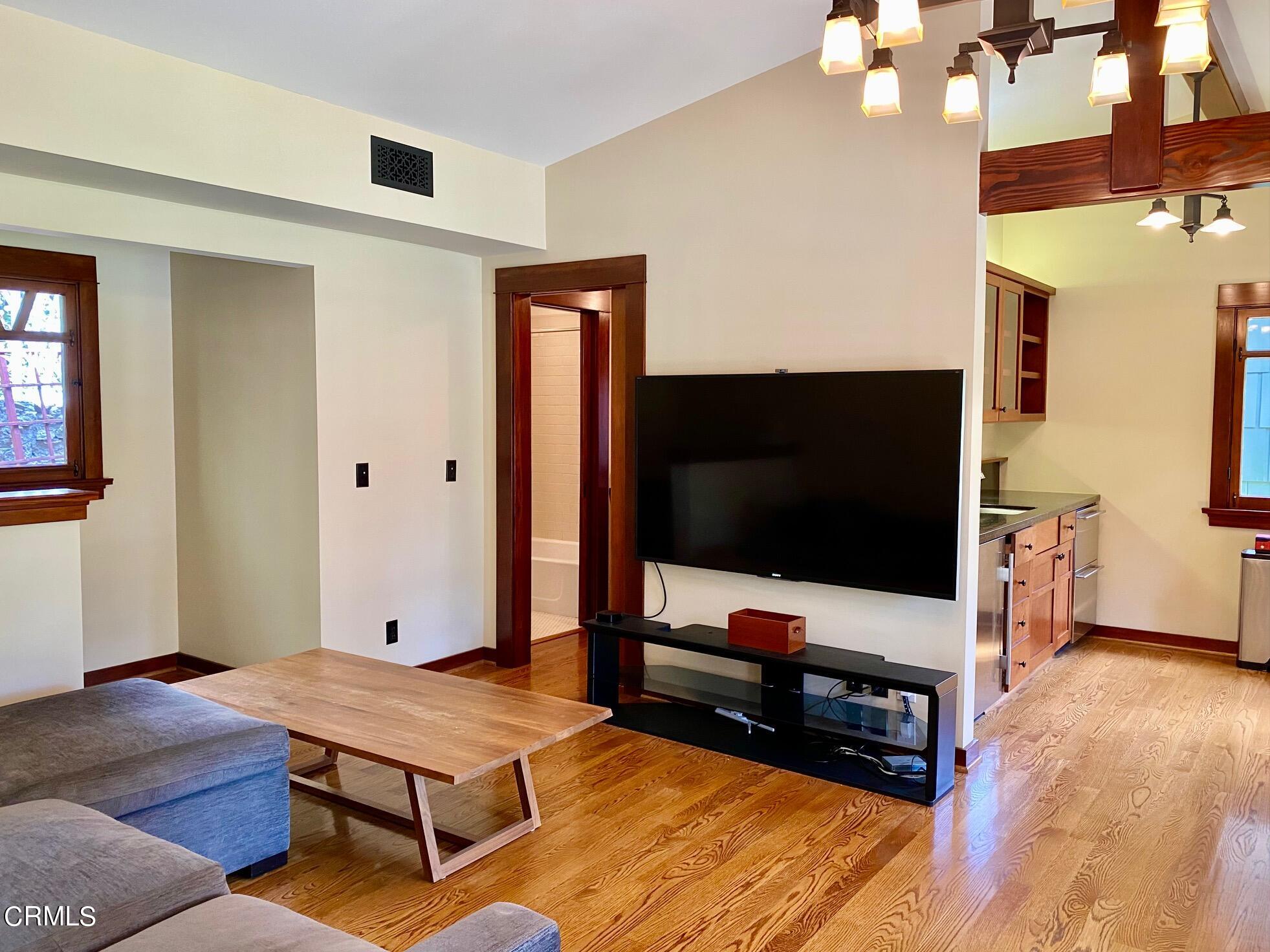 1361 Ridge Way Pasadena, CA 91106 - Photo 23 of 31 a living room with furniture and a flat screen tv