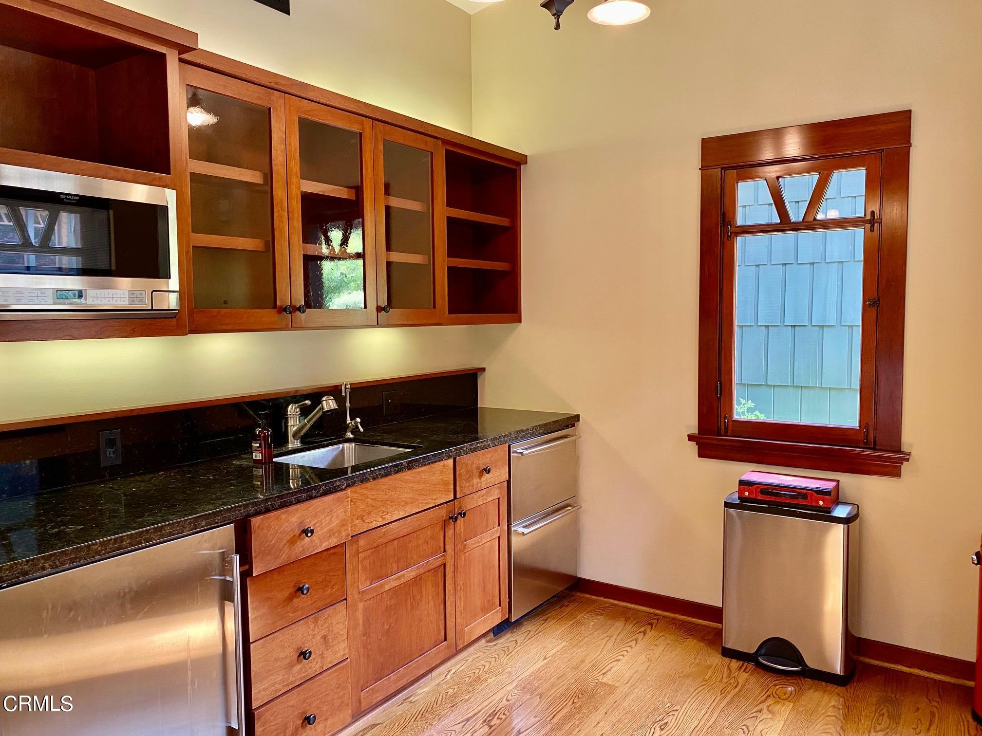 1361 Ridge Way Pasadena, CA 91106 - Photo 24 of 31 a kitchen with stainless steel appliances a stove and a microwave
