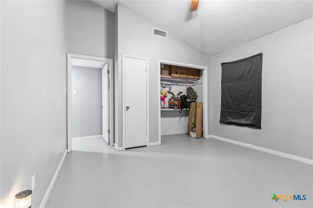 a spacious bathroom with a double vanity sink a mirror and a shower