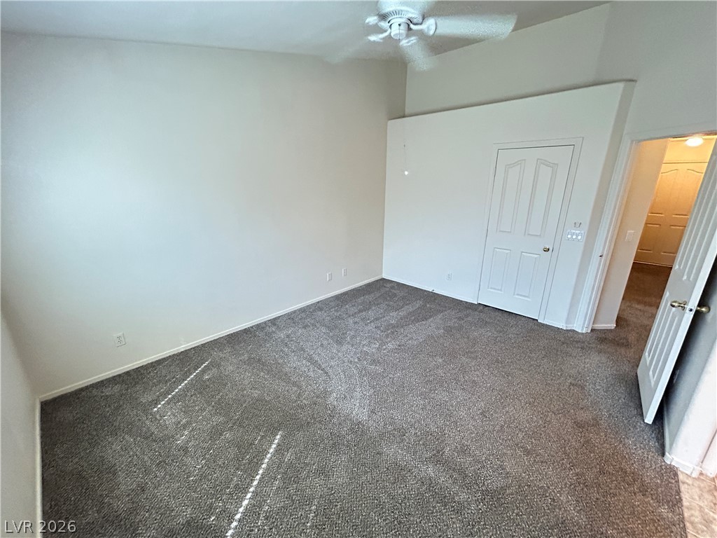 1840 Montvale Las Vegas, NV 89134 - Photo 24 of 31 A spacious bedroom with a vaulted ceiling and new carpeting awaits.