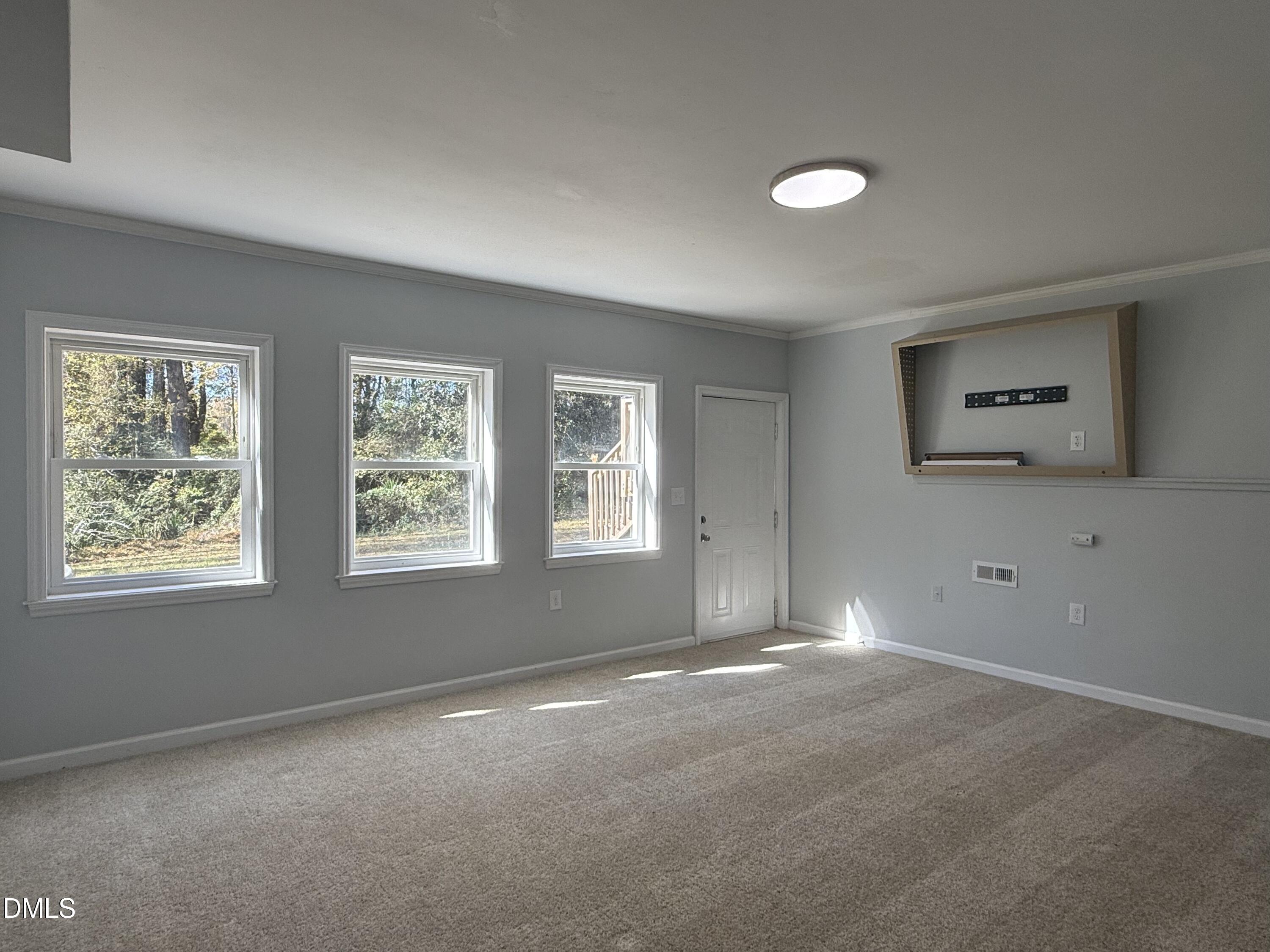 805 River Road Selma, NC 27576 - Photo 17 of 39 a view of an empty room with a window