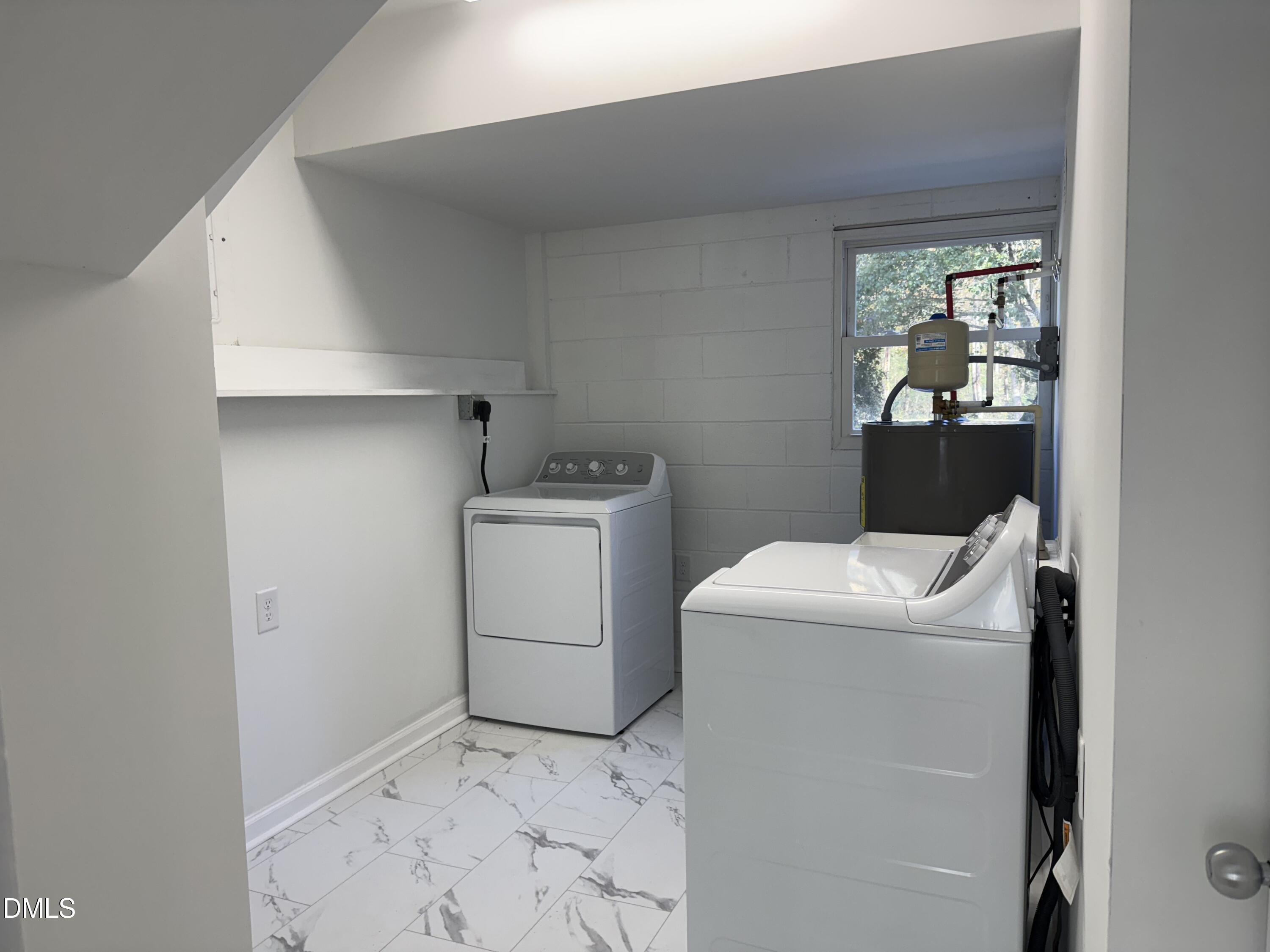 805 River Road Selma, NC 27576 - Photo 18 of 39 a utility room with dryer and washer
