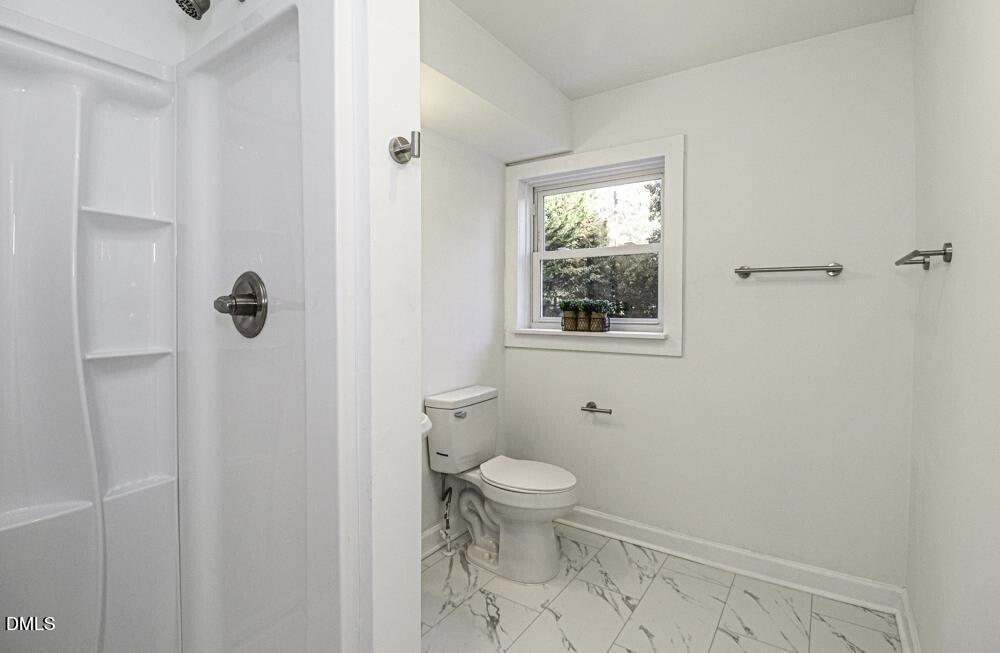 805 River Road Selma, NC 27576 - Photo 19 of 39 a bathroom with a toilet