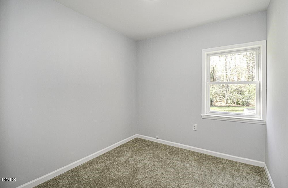 805 River Road Selma, NC 27576 - Photo 22 of 39 an empty room with a window
