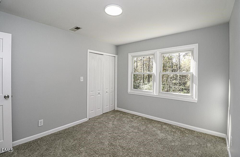 805 River Road Selma, NC 27576 - Photo 25 of 39 an empty room with windows