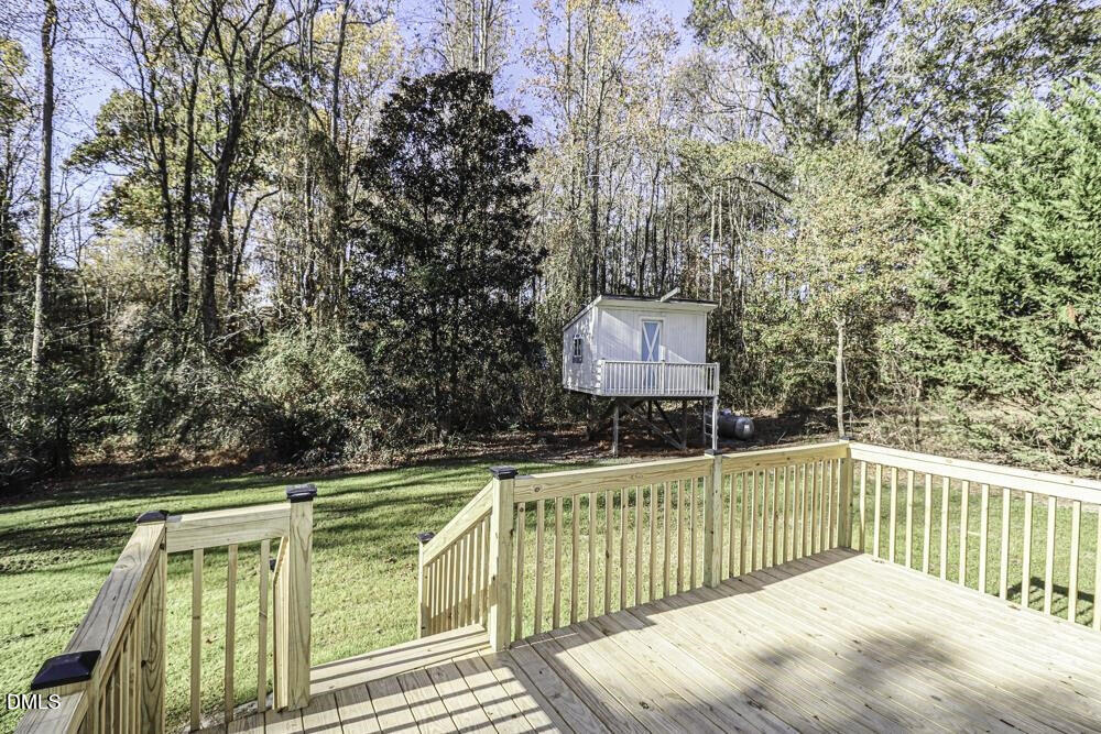 805 River Road Selma, NC 27576 - Photo 4 of 39 a view of balcony with wooden floor