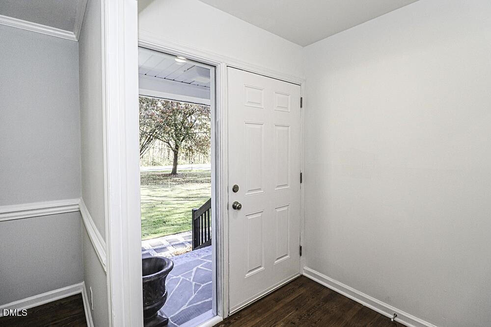 805 River Road Selma, NC 27576 - Photo 6 of 39 a view of an empty room with wooden floor and a window