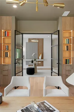 a view of a livingroom with furniture and stairs