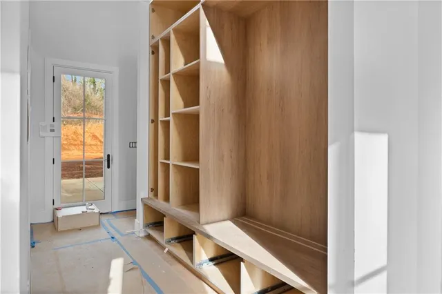 a view of wooden floor and closet