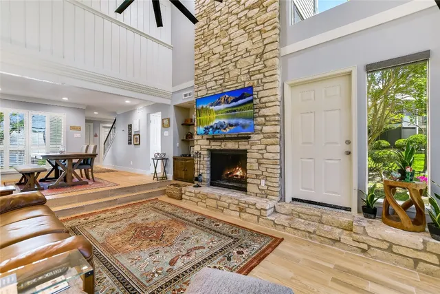 a living room with furniture and a fireplace