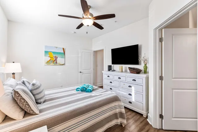 a bedroom with a bed and flat screen tv