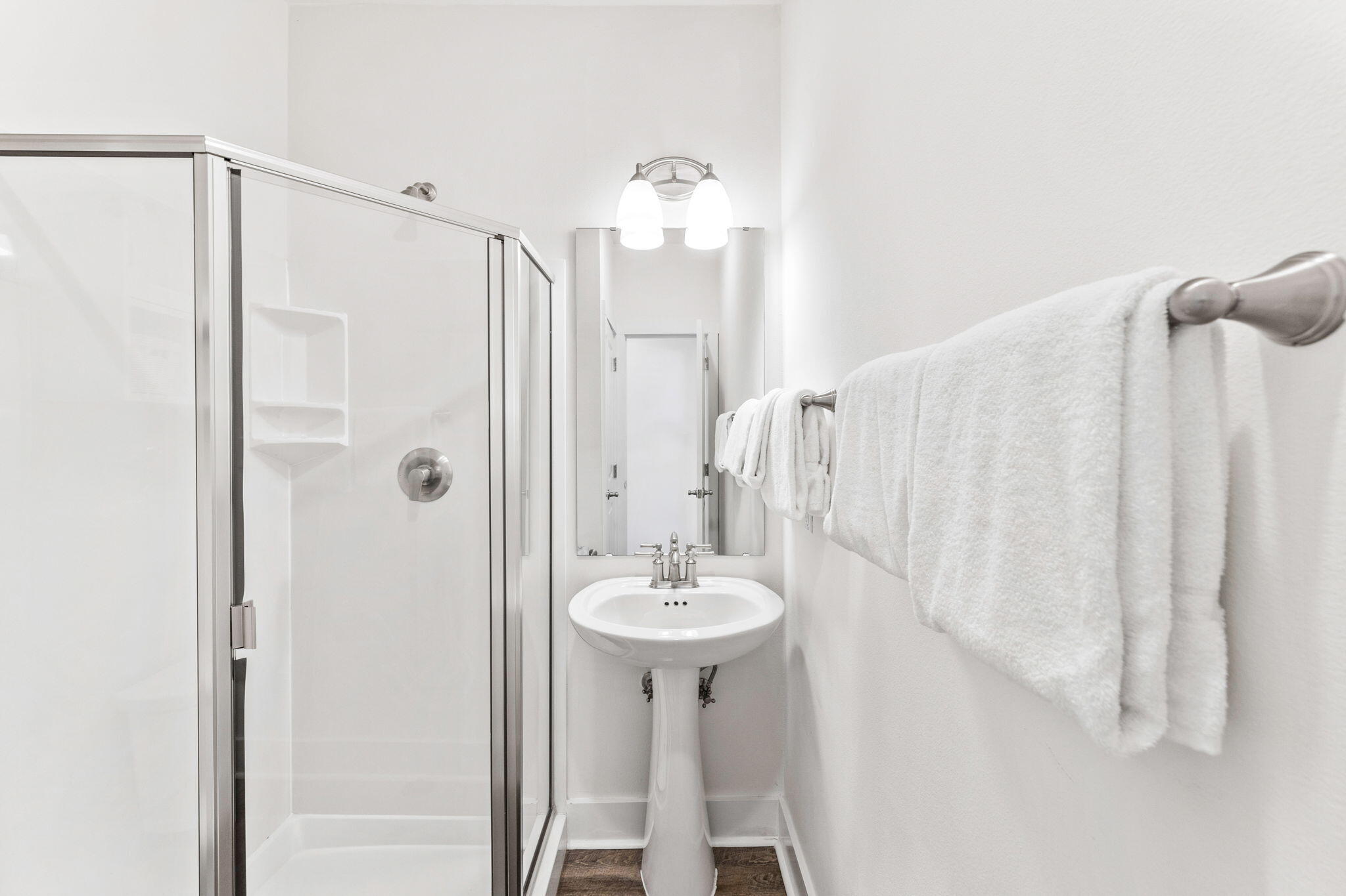 3958 West County Highway 30A, Unit 112 Santa Rosa Beach, FL 32459 - Photo 23 of 45 a bathroom with a sink a mirror and a shower