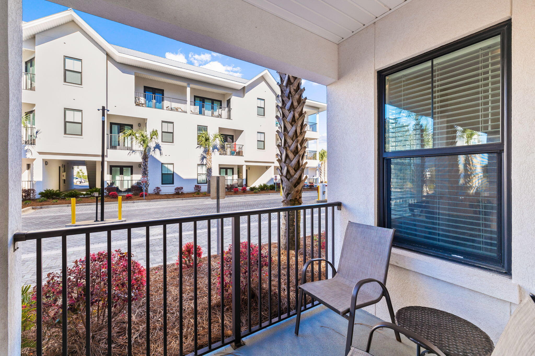 3958 West County Highway 30A, Unit 112 Santa Rosa Beach, FL 32459 - Photo 25 of 45 a view of a balcony with chairs