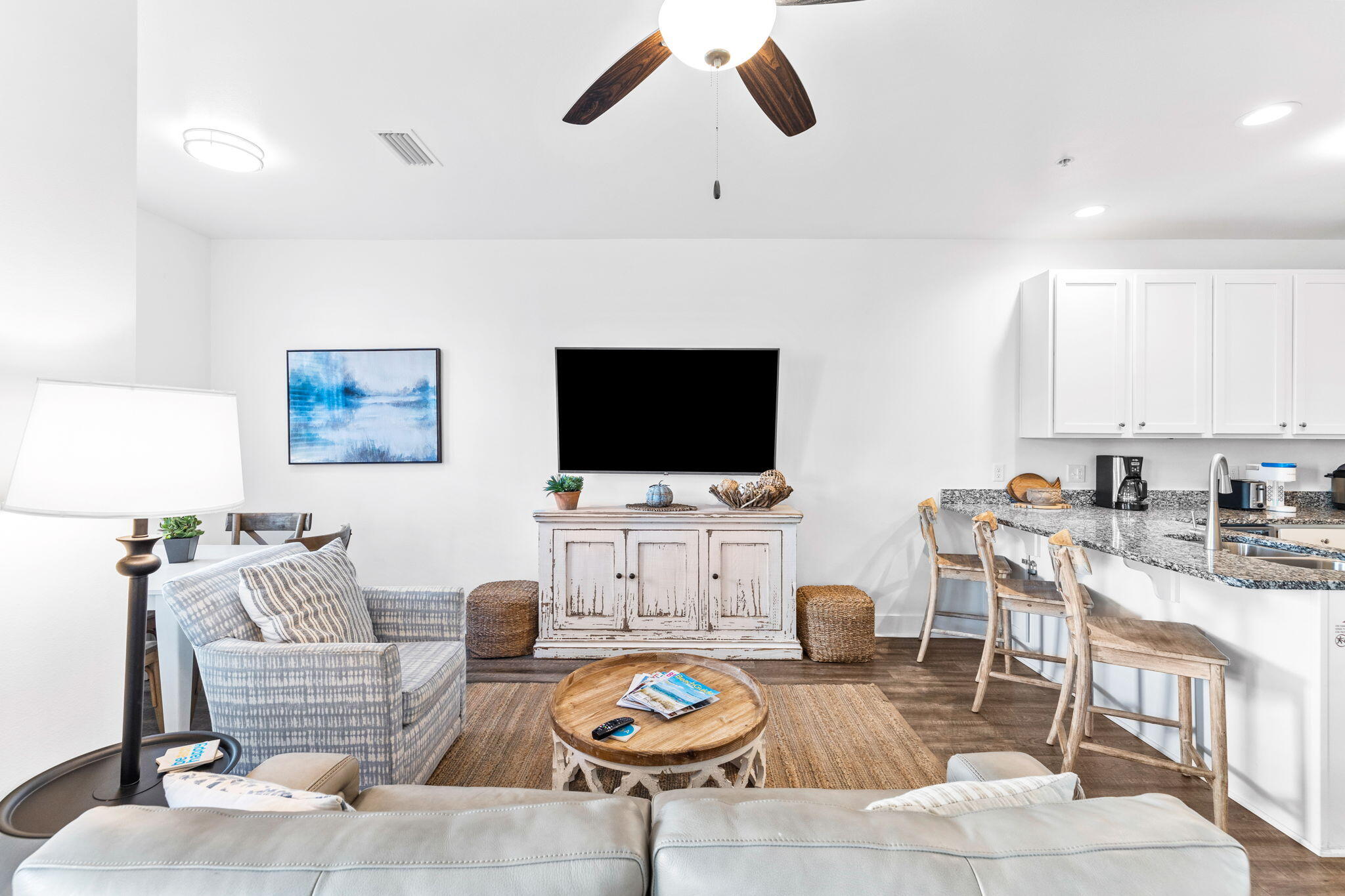 3958 West County Highway 30A, Unit 112 Santa Rosa Beach, FL 32459 - Photo 7 of 45 a living room with furniture a flat screen tv and kitchen view