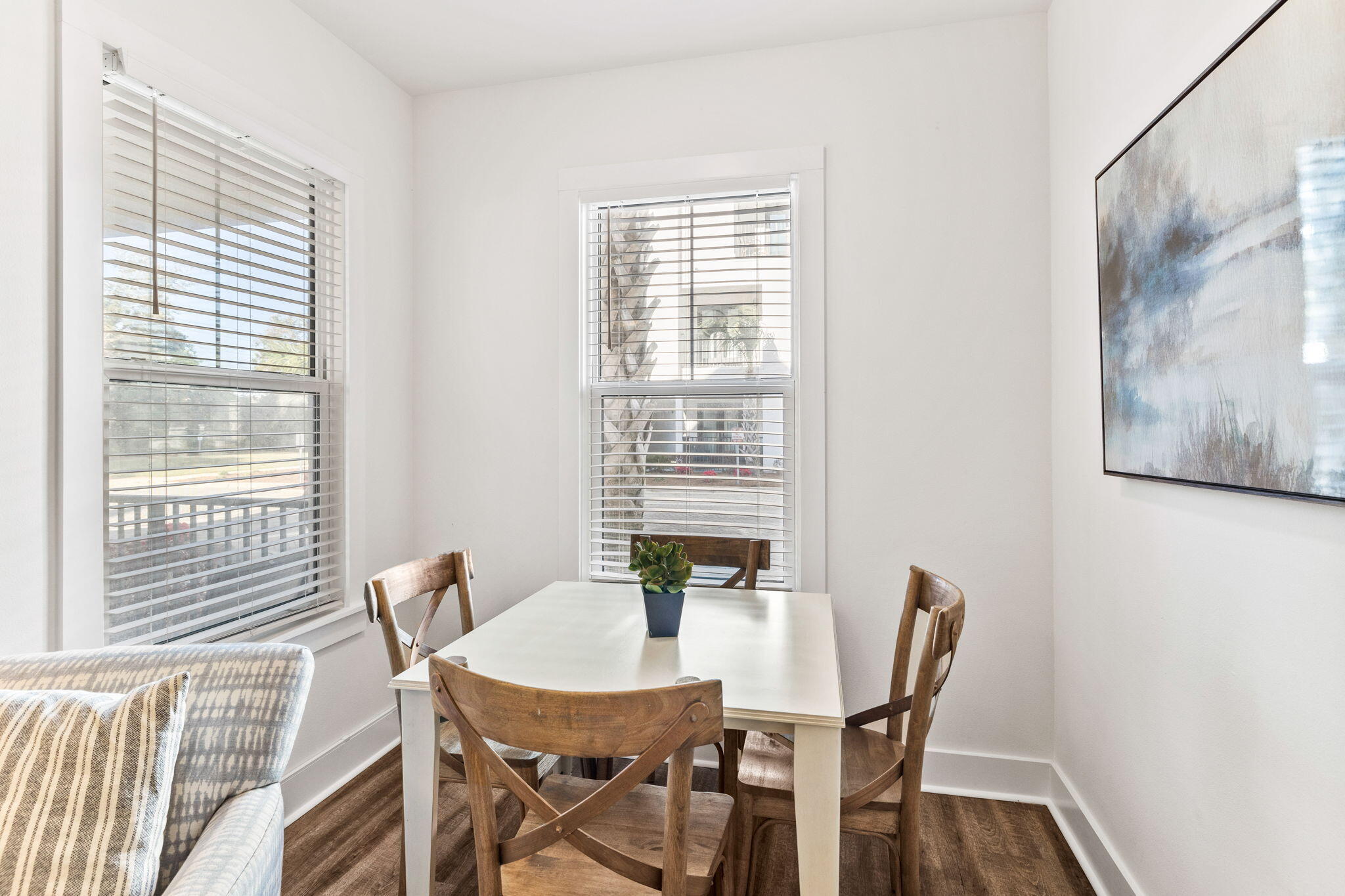 3958 West County Highway 30A, Unit 112 Santa Rosa Beach, FL 32459 - Photo 9 of 45 a view of a dining room with furniture and wooden floor