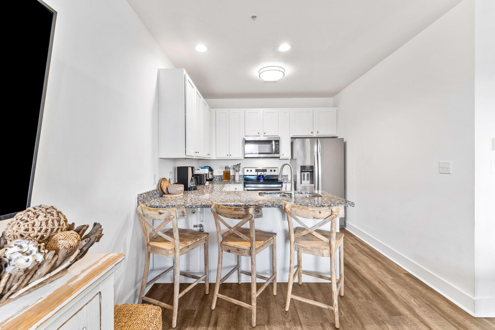 3958 West County Highway 30A, Unit 112 Santa Rosa Beach, FL 32459 - Photo 10 of 45 a dining room with furniture and kitchen view