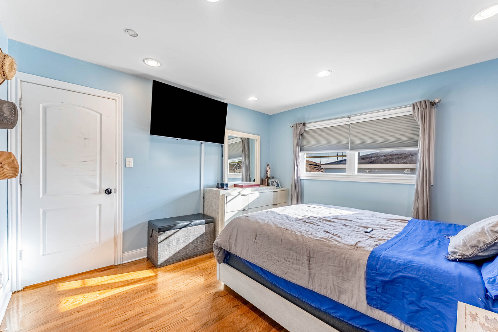 3605 West 56th Place Chicago, IL 60629 - Photo 13 of 23 a bedroom with a bed and a flat screen tv