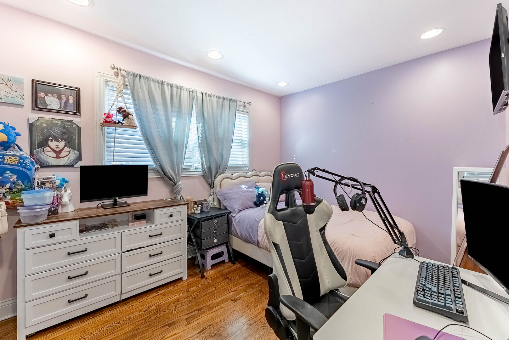 3605 West 56th Place Chicago, IL 60629 - Photo 17 of 23 a bedroom with a bed and a flat screen tv