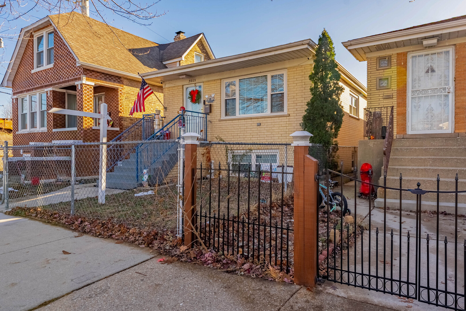 3605 West 56th Place Chicago, IL 60629 - Photo 2 of 23 a front view of a house with iron fence