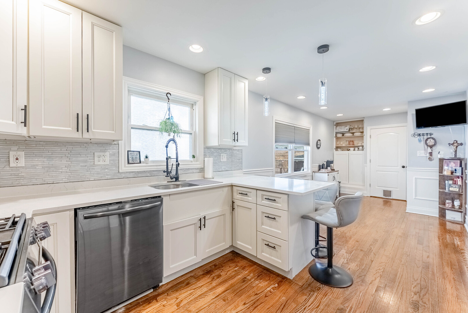 3605 West 56th Place Chicago, IL 60629 - Photo 5 of 23 a kitchen with sink cabinets and wooden floor