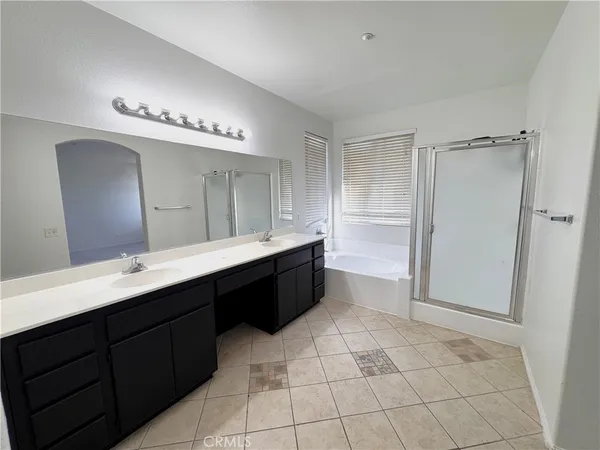 a white toilet sitting next to a sink