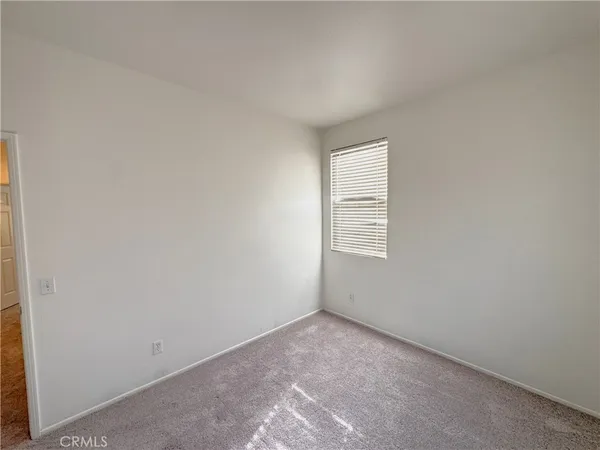 a bathroom with a double vanity sink toilet mirror and bathtub