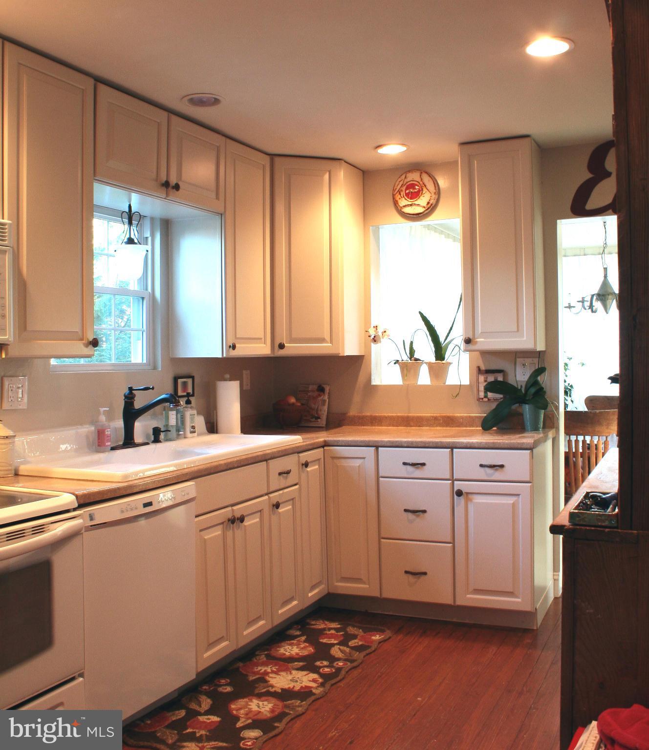 Galley Kitchen has beautiful Pine floors