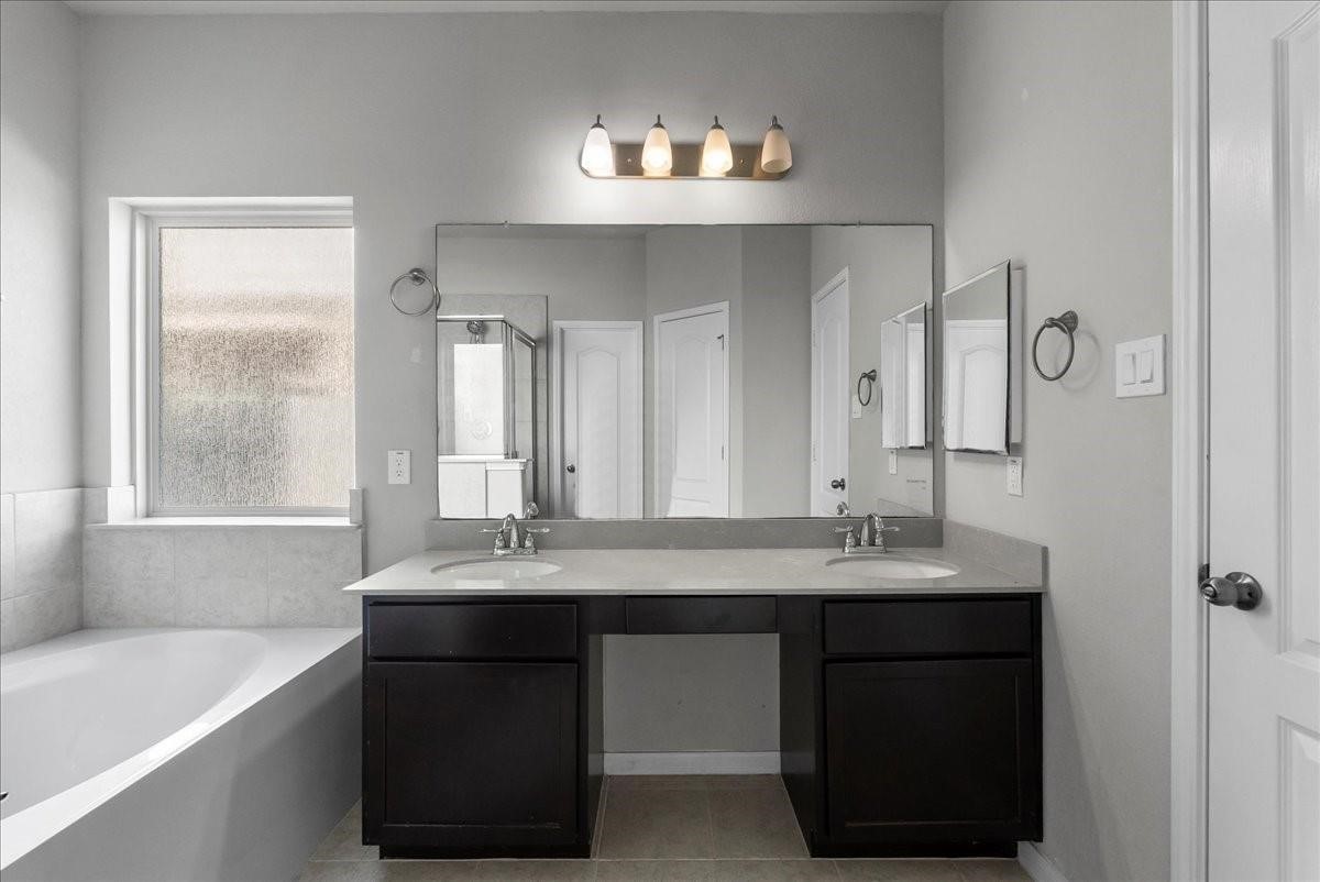 5111 Bay Lane Bacliff, TX 77518 - Photo 20 of 48 a bathroom with a sink double vanity and a mirror