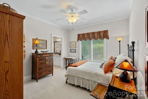a bedroom with bed and window