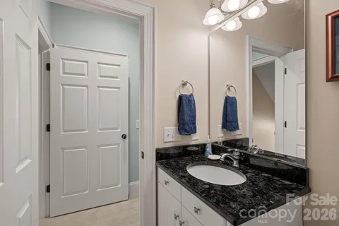 a bathroom with double sink and a mirror