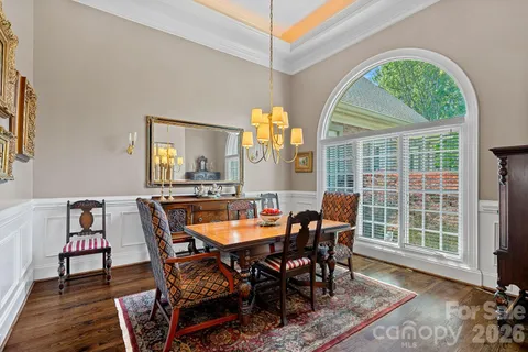 a view of a dining room with furniture and window