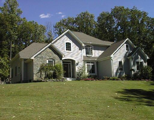 43 Wolfpits Rd. Bethel, CT 06801 - Photo 1 of 1 a front view of house with yard and trees in the background