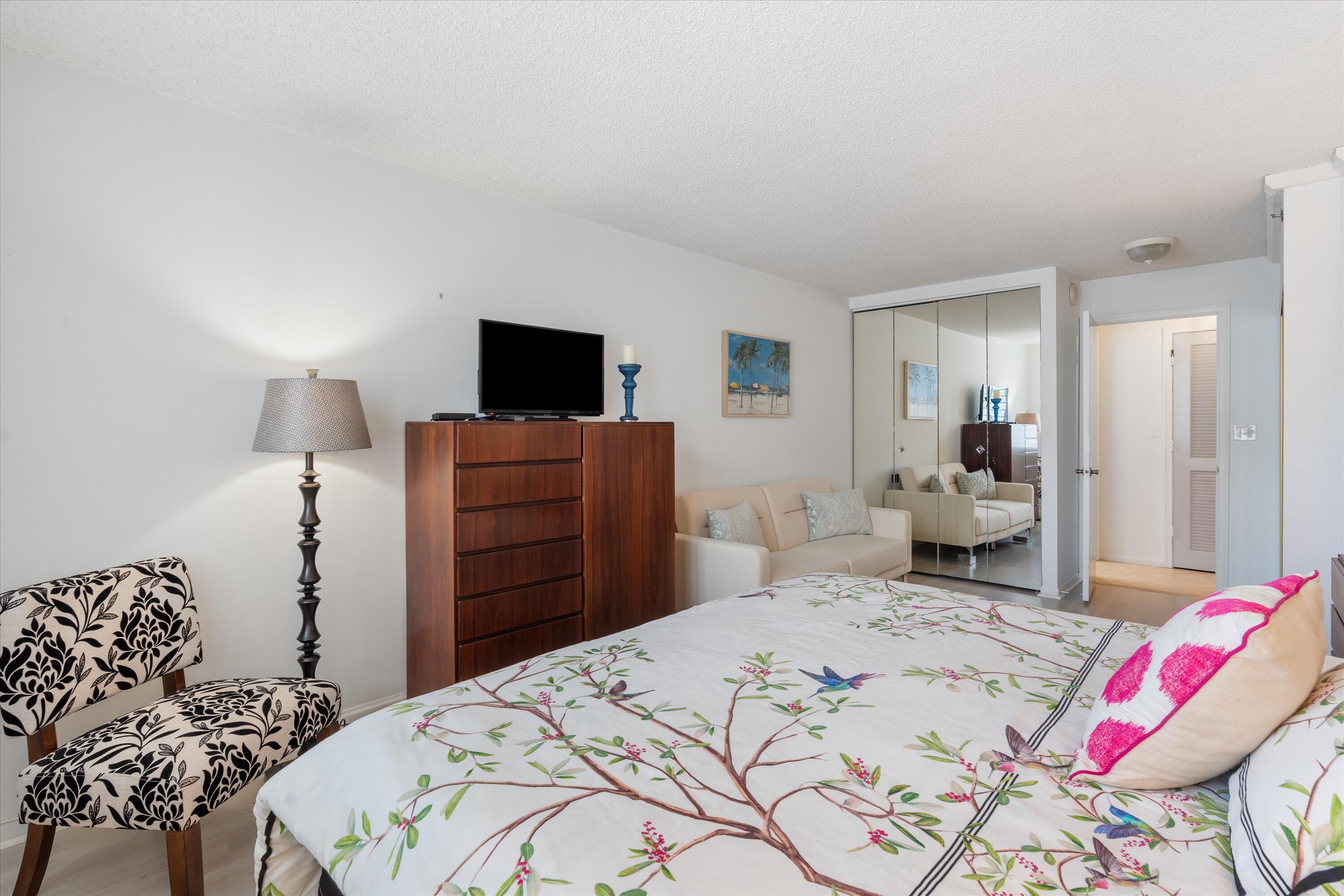 3301 South Ocean Boulevard, Unit 808 Highland Beach, FL 33487 - Photo 11 of 33 a bedroom with a bed and a television