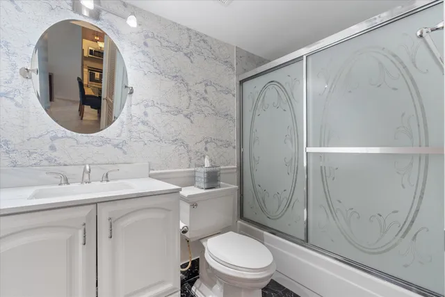 a bedroom with furniture and a large mirror