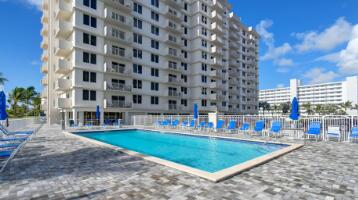 3301 South Ocean Boulevard, Unit 808 Highland Beach, FL 33487 - Photo 15 of 33 a view of a swimming pool and a yard