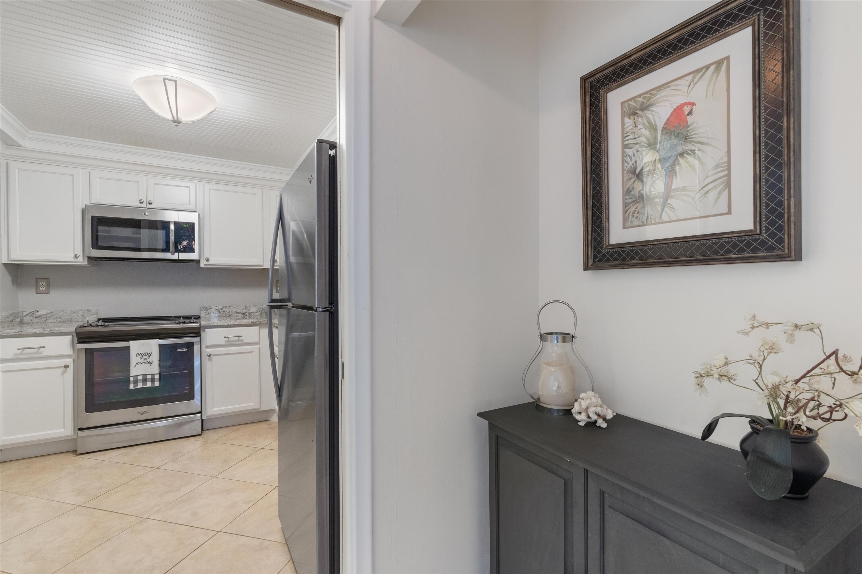 3301 South Ocean Boulevard, Unit 808 Highland Beach, FL 33487 - Photo 20 of 33 a kitchen with a microwave and a sink