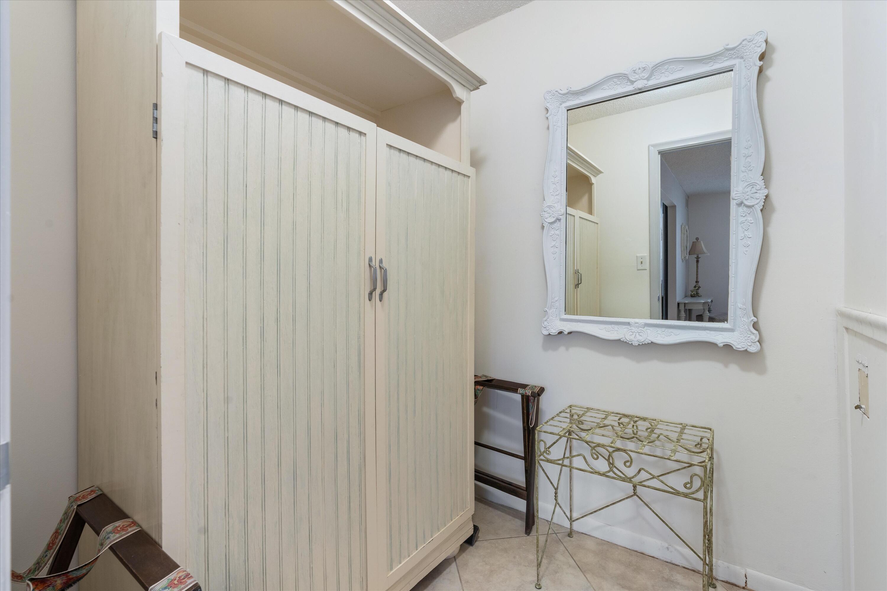 3301 South Ocean Boulevard, Unit 808 Highland Beach, FL 33487 - Photo 23 of 33 a bathroom with a mirror and a shower