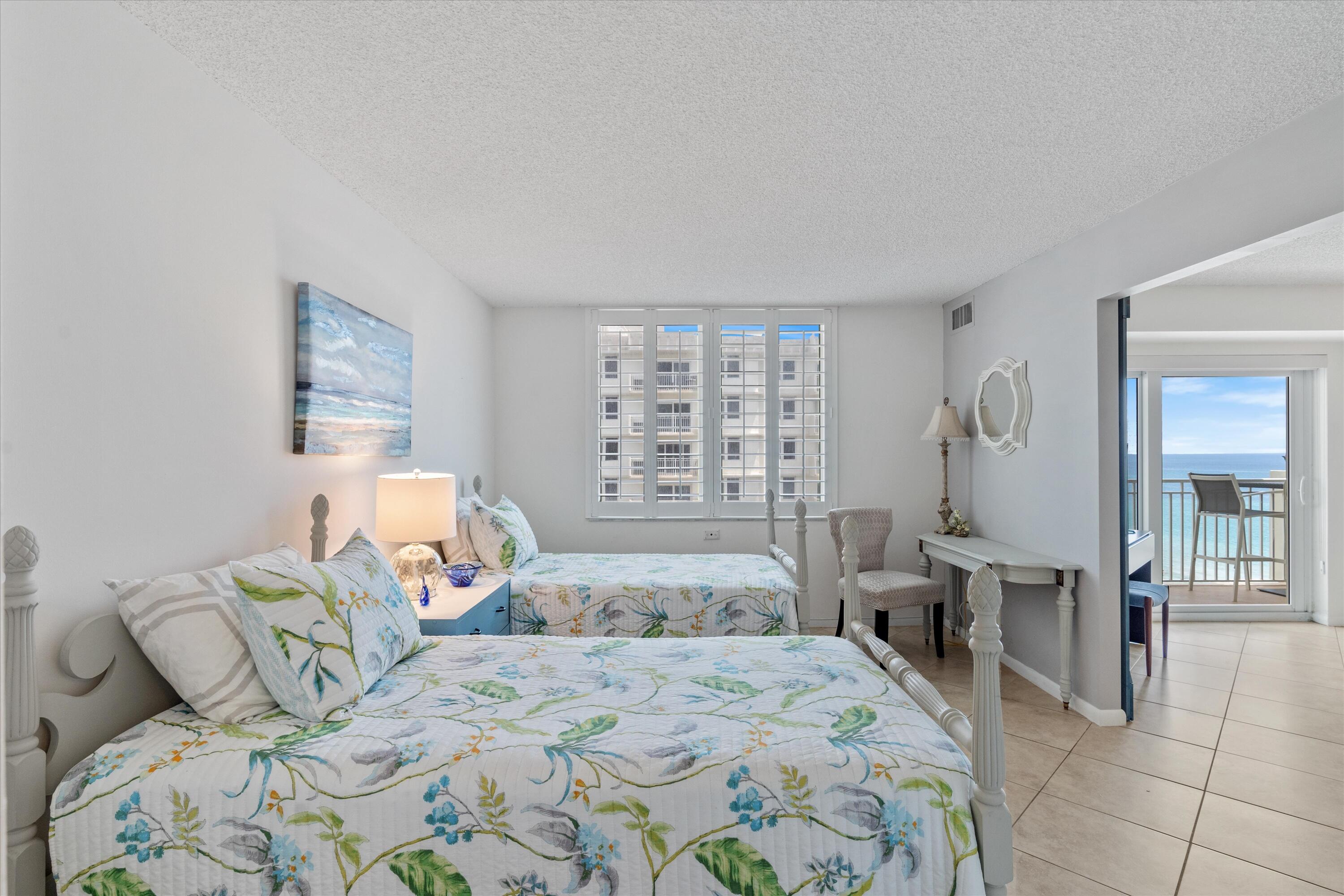 3301 South Ocean Boulevard, Unit 808 Highland Beach, FL 33487 - Photo 3 of 33 a bedroom with a large bed and a window