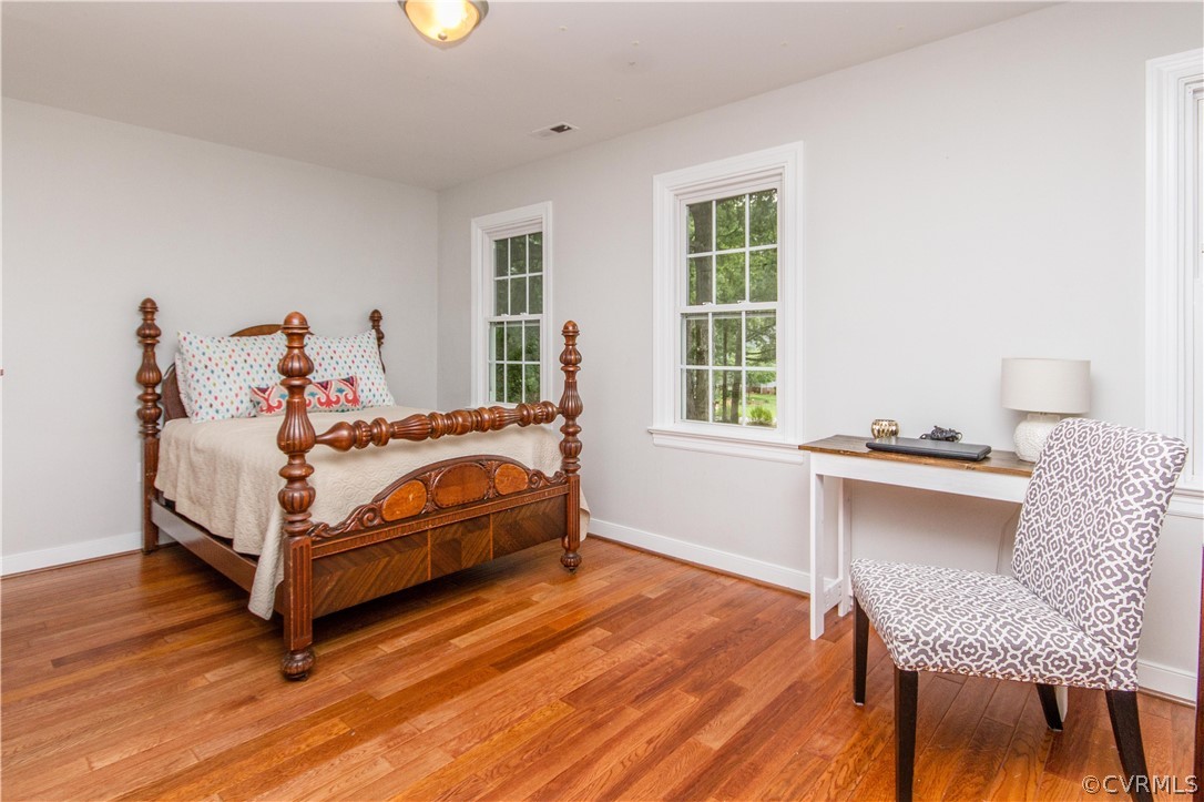 3902 Paces Ferry Road Chester, VA 23831 - Photo 16 of 31 a bed sitting in a bedroom next to a window