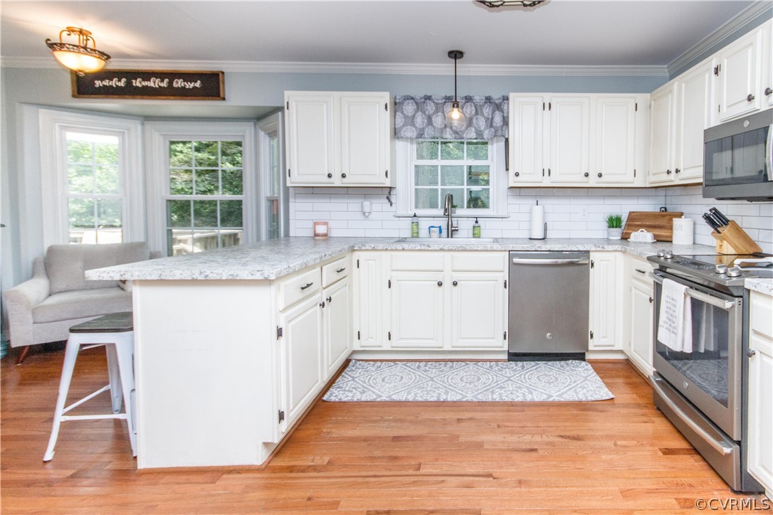 3902 Paces Ferry Road Chester, VA 23831 - Photo 4 of 31 a kitchen with a stove a sink and a window