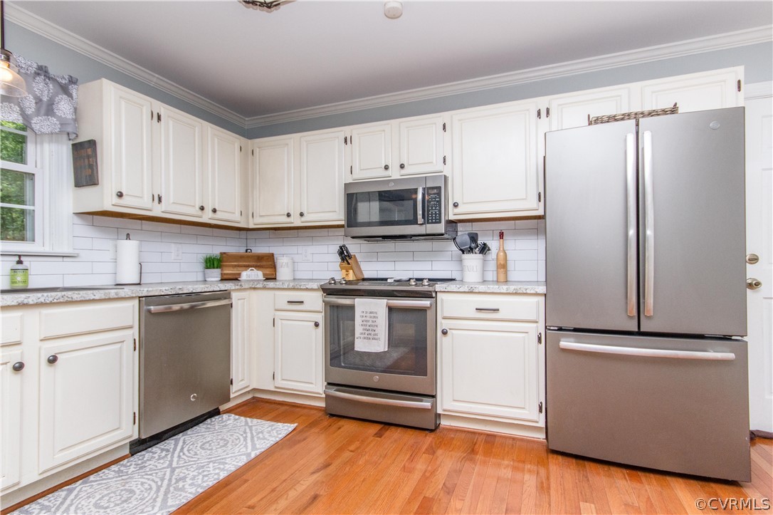 3902 Paces Ferry Road Chester, VA 23831 - Photo 8 of 31 a kitchen with granite countertop white cabinets and stainless steel appliances